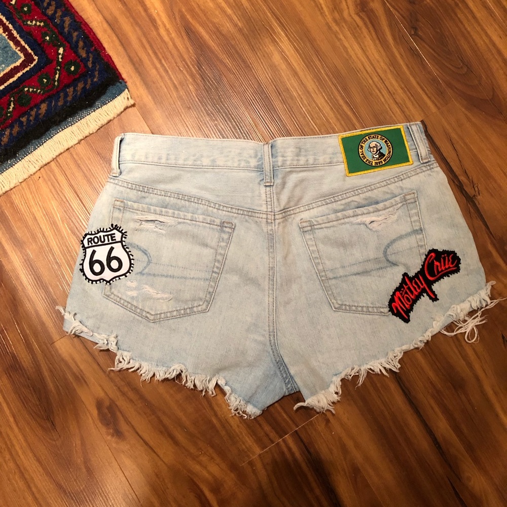 Button fly distressed shorts